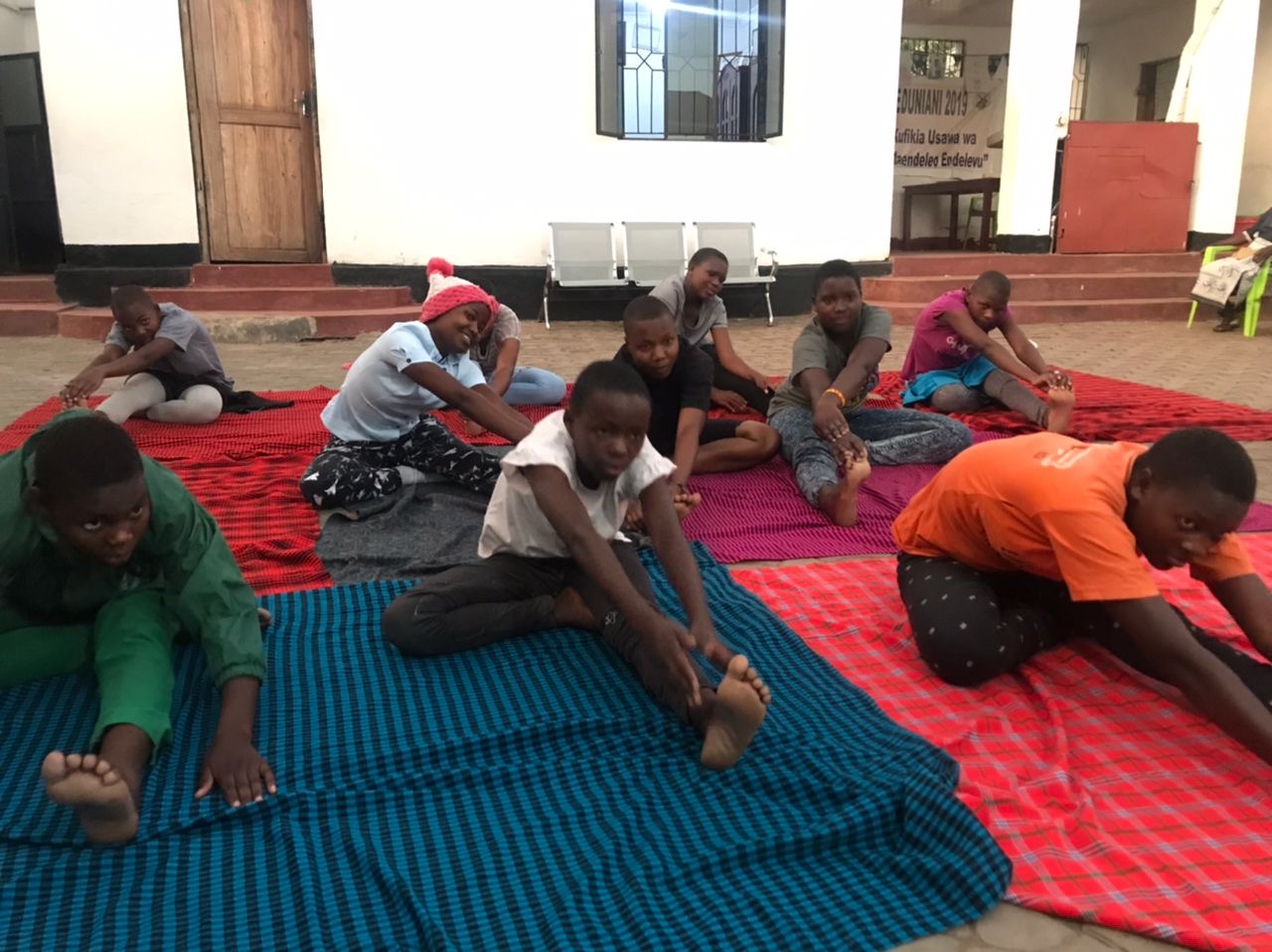 Girls doing yoga at safe houses